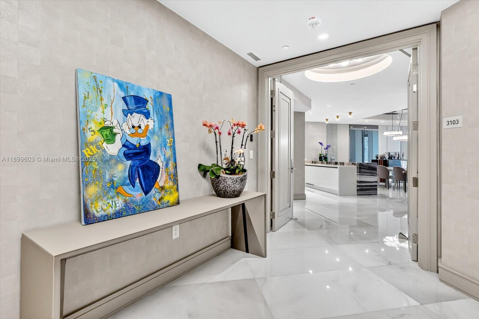 17901 Collins Avenue, Unit 3103 Sunny Isles Beach, FL 33160 - Photo 10 of 38 a view of hallway with furniture and a chandelier