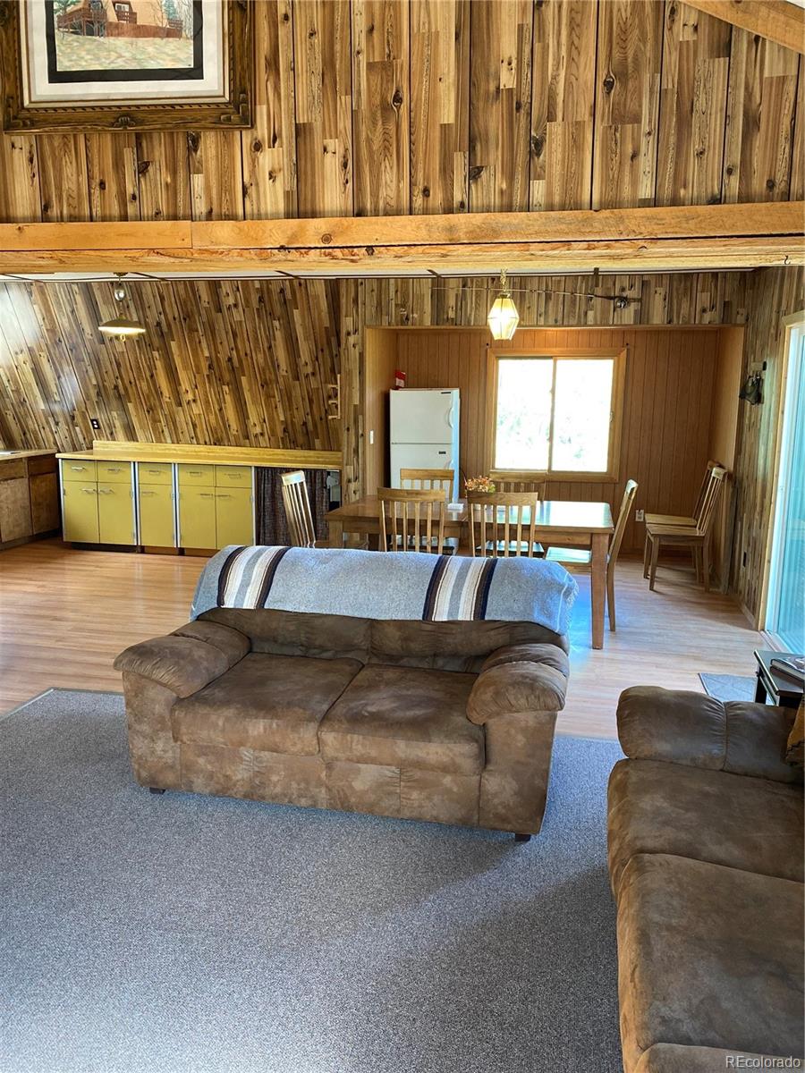 259 Bordenville Road Jefferson, CO 80456 - Photo 22 of 47 a living room with furniture and a fireplace