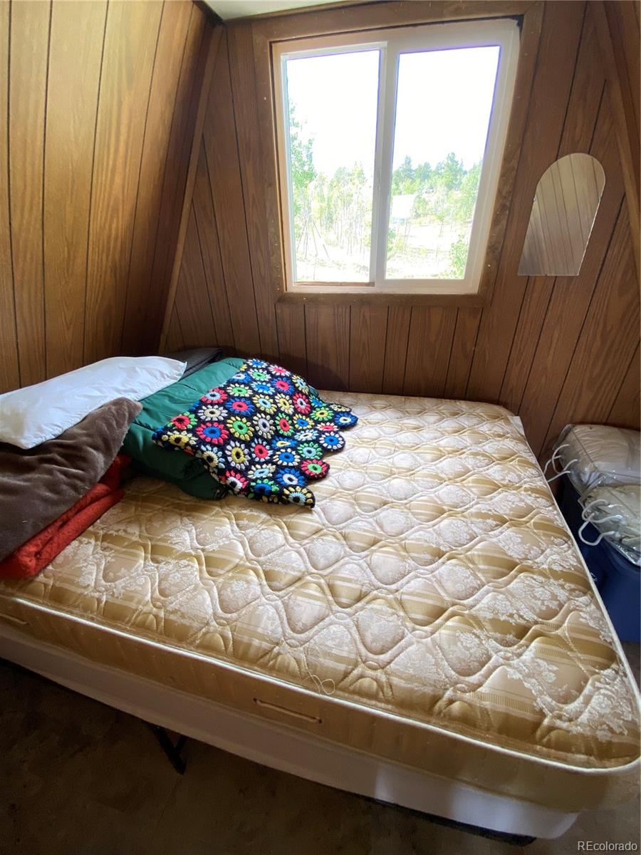 259 Bordenville Road Jefferson, CO 80456 - Photo 29 of 47 a bedroom with a bed and a window