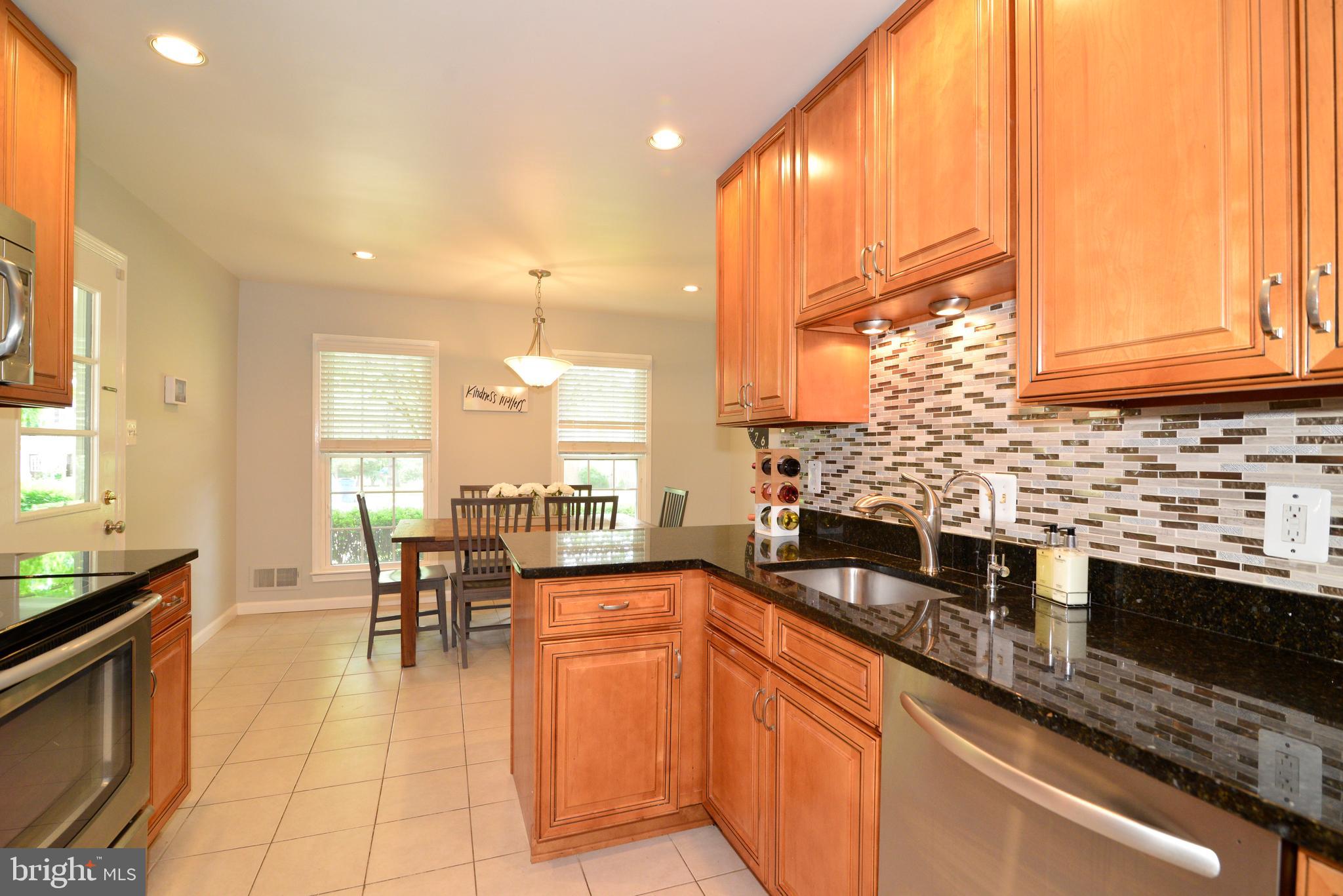 1501 Coat Ridge Road Herndon, VA 20170 - Photo 5 of 29 Kitchen with Glass Backsplash.