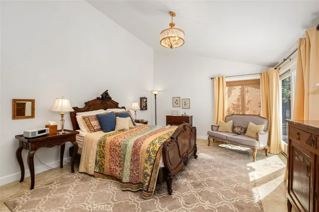 a bedroom with a bed and a couch