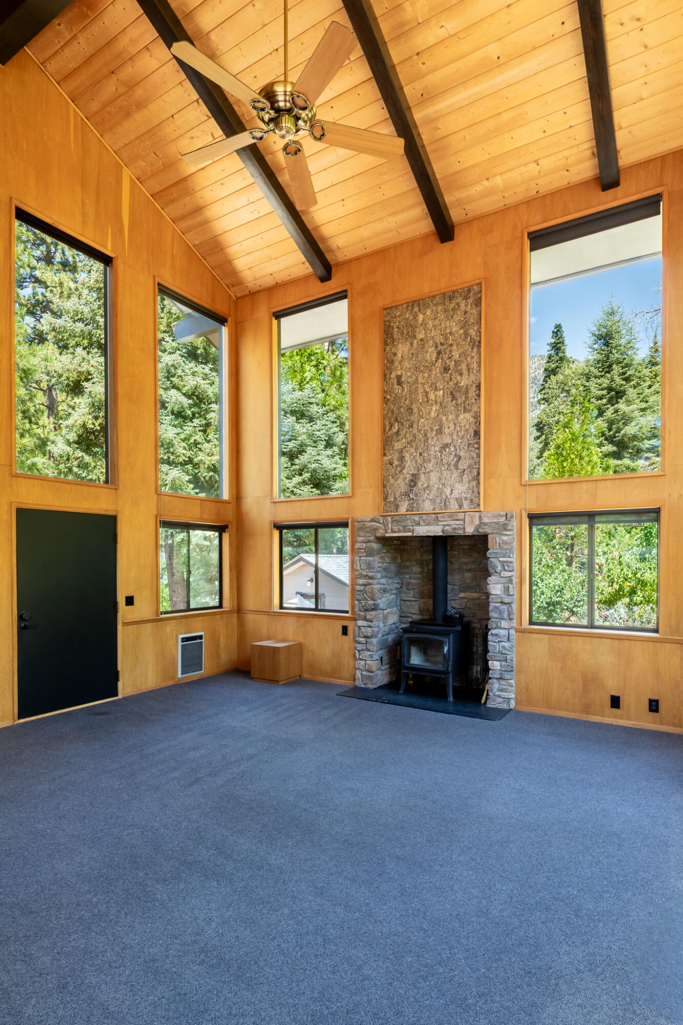 24752 Fern Valley Road Idyllwild, CA 92549 - Photo 11 of 35 an empty room with furniture and a fireplace