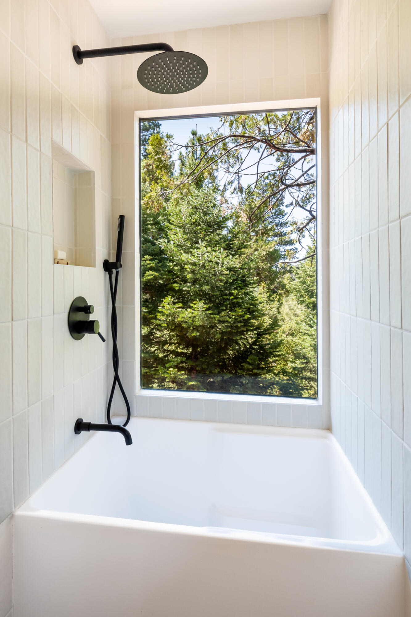 24752 Fern Valley Road Idyllwild, CA 92549 - Photo 26 of 35 a bathroom with a bathtub and a shower