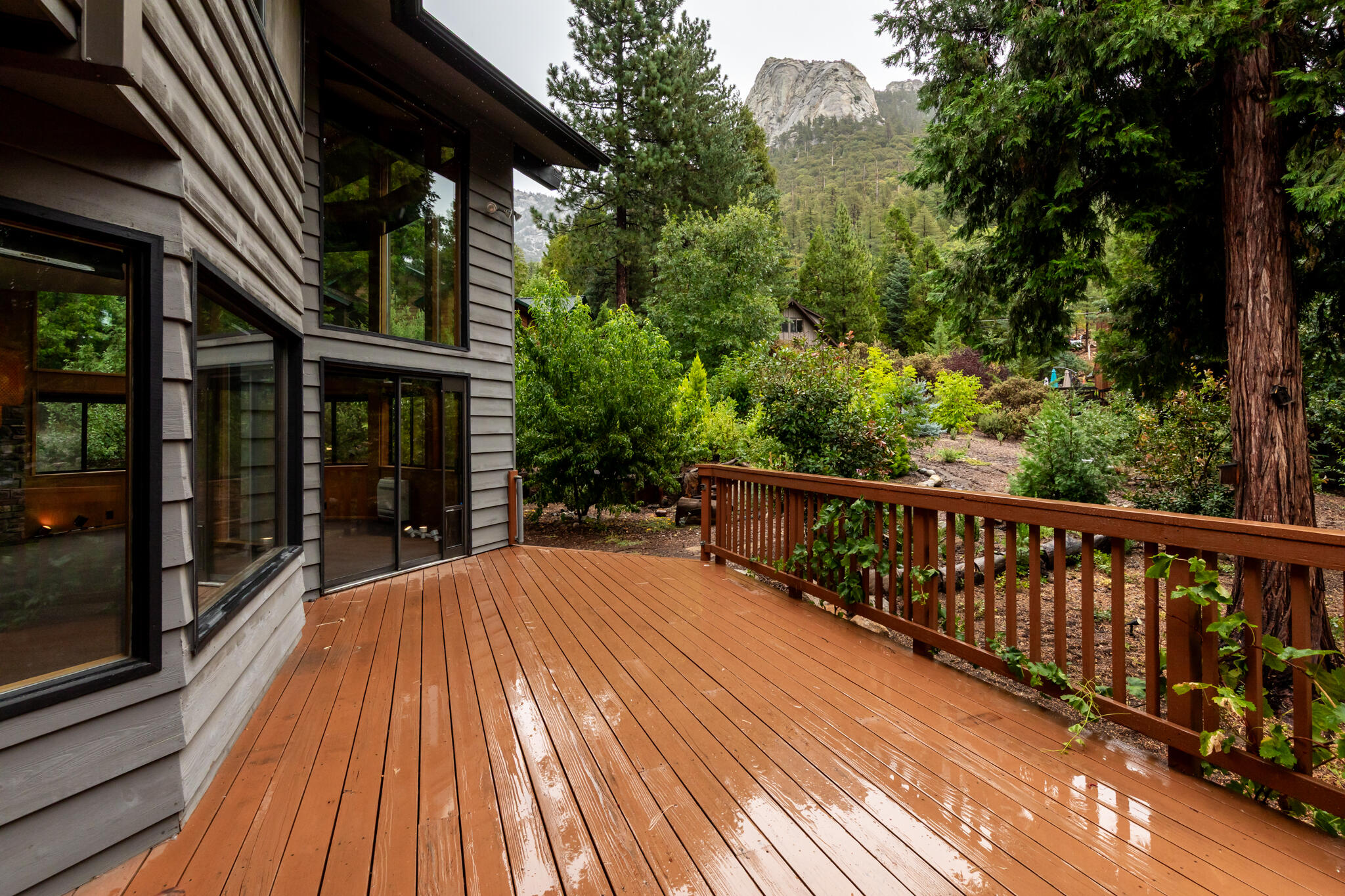 24752 Fern Valley Road Idyllwild, CA 92549 - Photo 5 of 35 a balcony with wooden floor and outdoor space