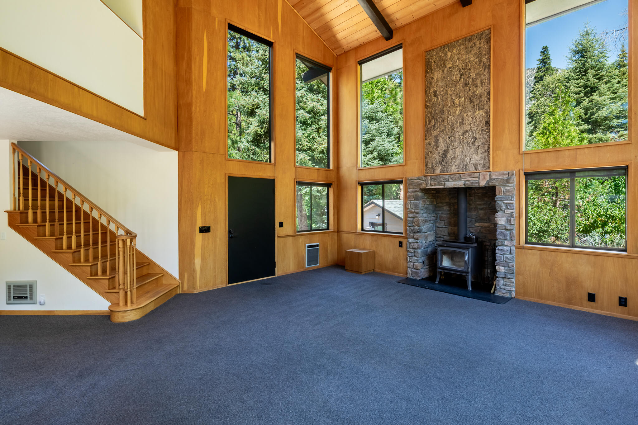24752 Fern Valley Road Idyllwild, CA 92549 - Photo 9 of 35 a view of an empty room with furniture and a fireplace