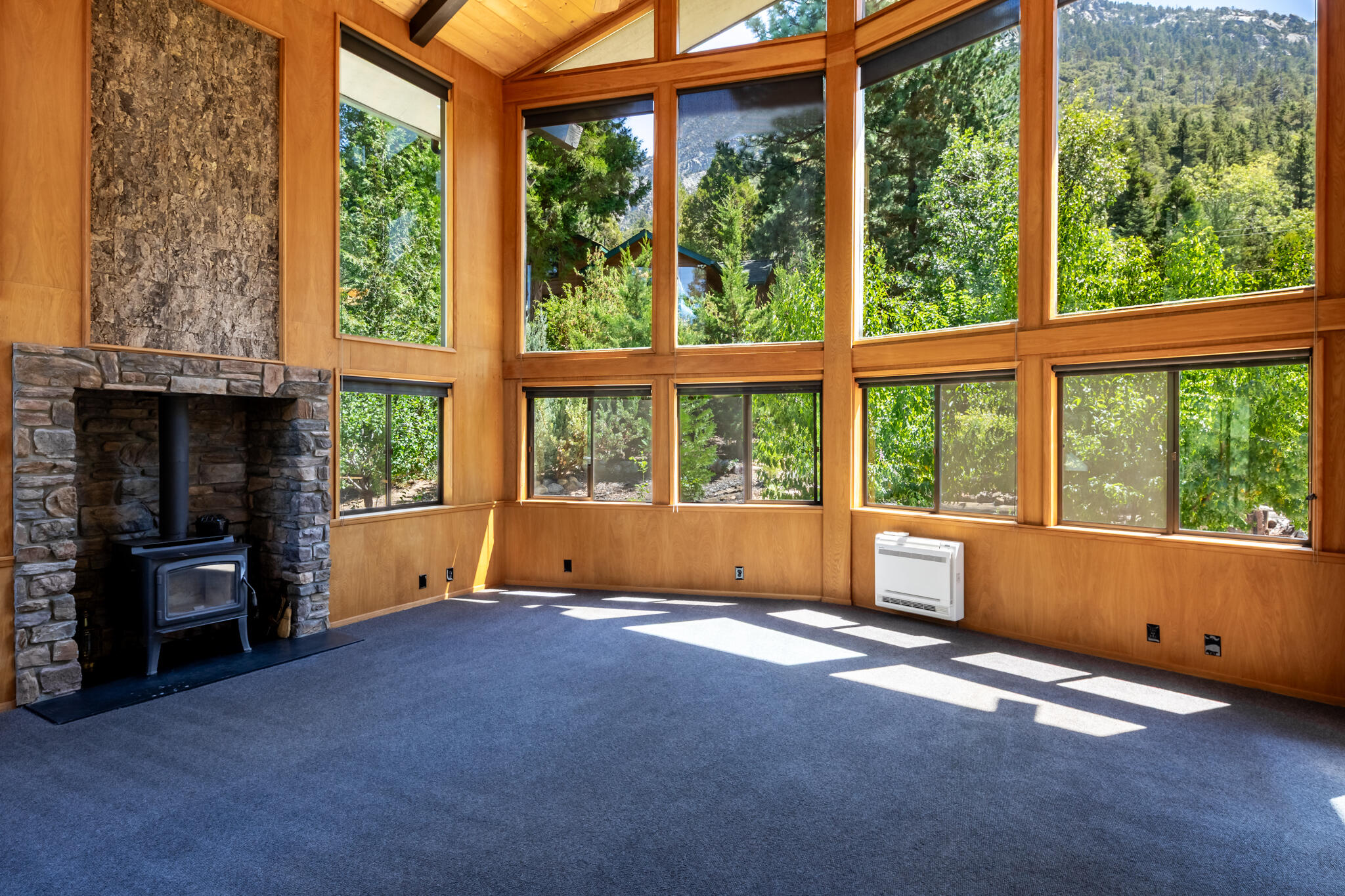 24752 Fern Valley Road Idyllwild, CA 92549 - Photo 10 of 35 a spacious bedroom with a large window and a bed