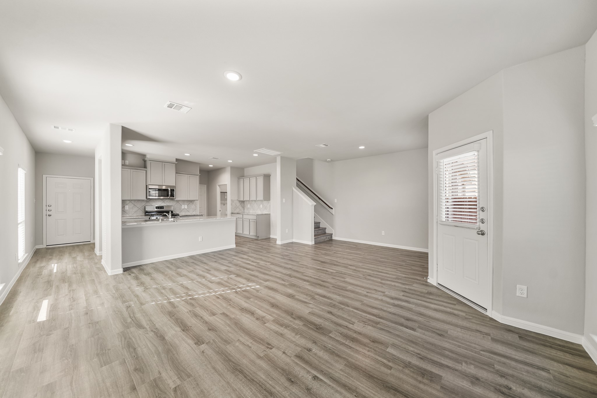 13313 Talisker Road Houston, TX 77048 - Photo 3 of 11 a view of kitchen and hall with wooden floor