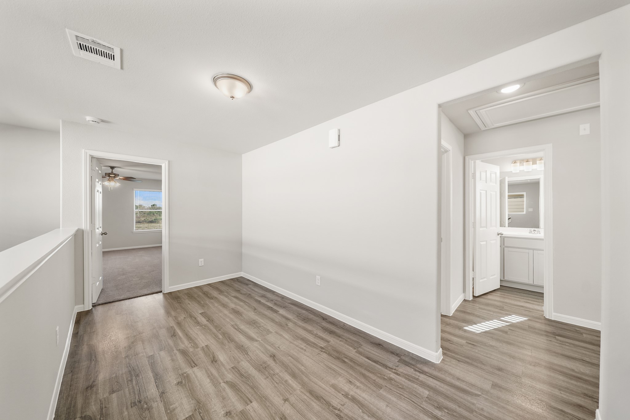 13313 Talisker Road Houston, TX 77048 - Photo 4 of 11 wooden floor in an empty room with a window