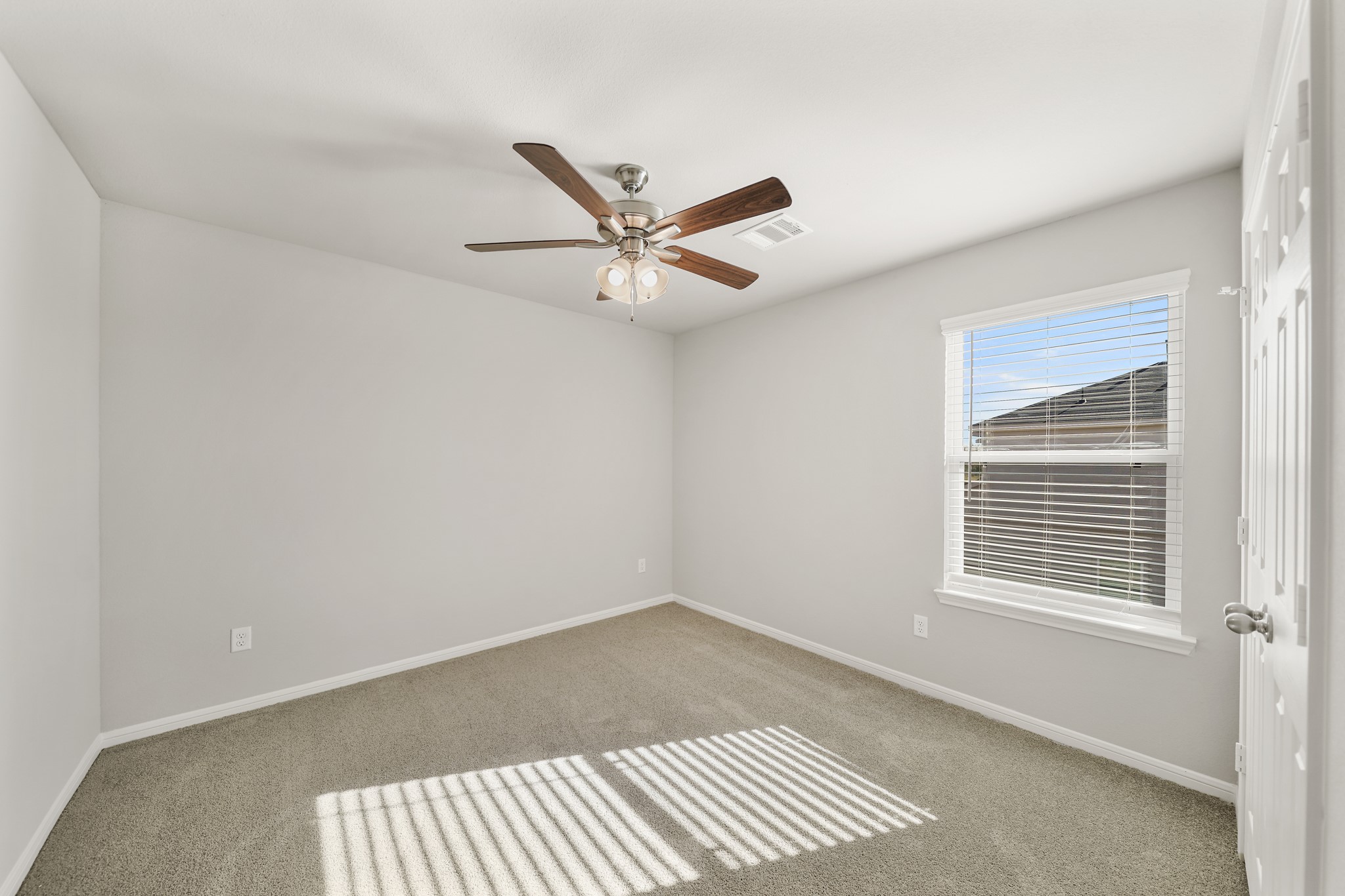 13313 Talisker Road Houston, TX 77048 - Photo 6 of 11 a view of an empty room with a window