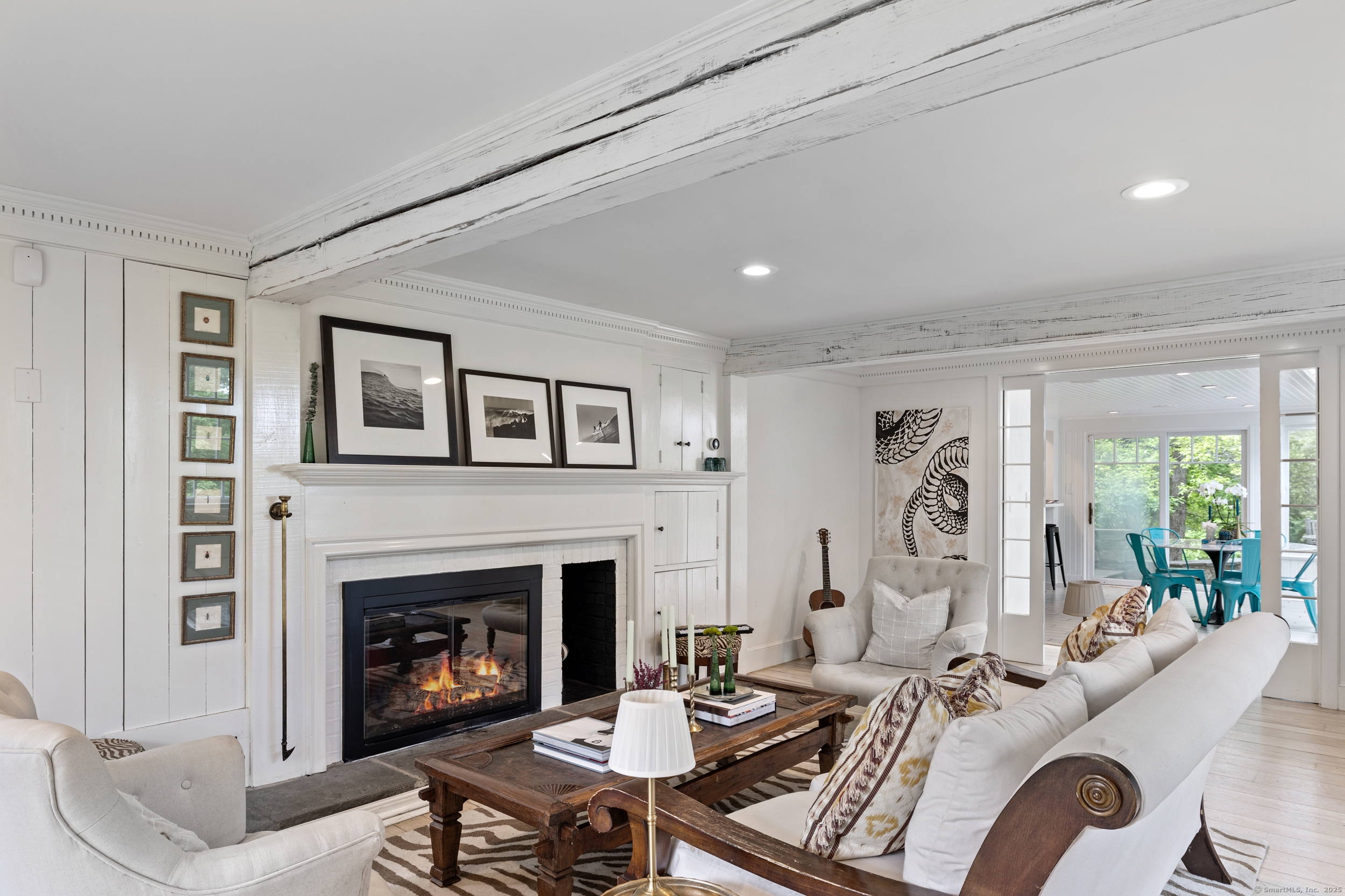 467 Laurel Road New Canaan, CT 06840 - Photo 4 of 32 a living room with furniture fireplace and a table