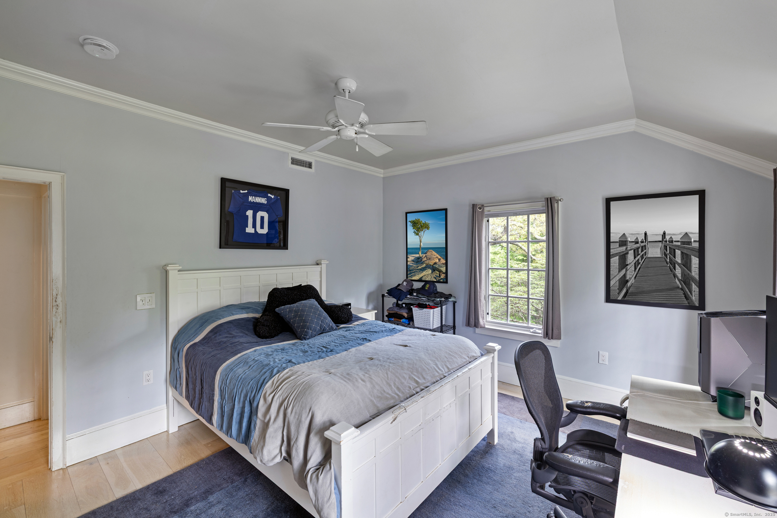 467 Laurel Road New Canaan, CT 06840 - Photo 9 of 32 a bedroom with a bed a couch and a window