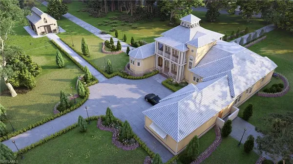 an aerial view of a house with a garden and swimming pool