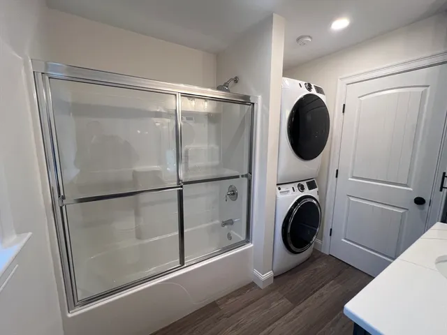 a view of a hallway with washer and dryer