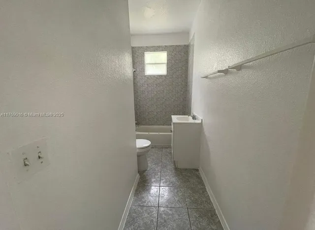 a bathroom with a toilet