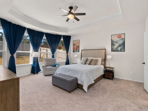 a bedroom with bed and window