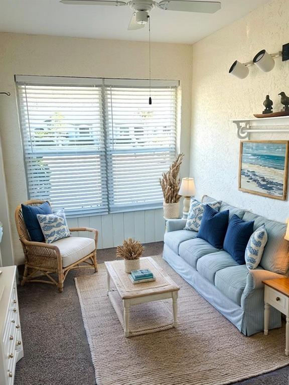 2033 Hawkhurst Circle, Unit 180 Sun City Center, FL 33573 - Photo 11 of 19 a living room with furniture and a large window