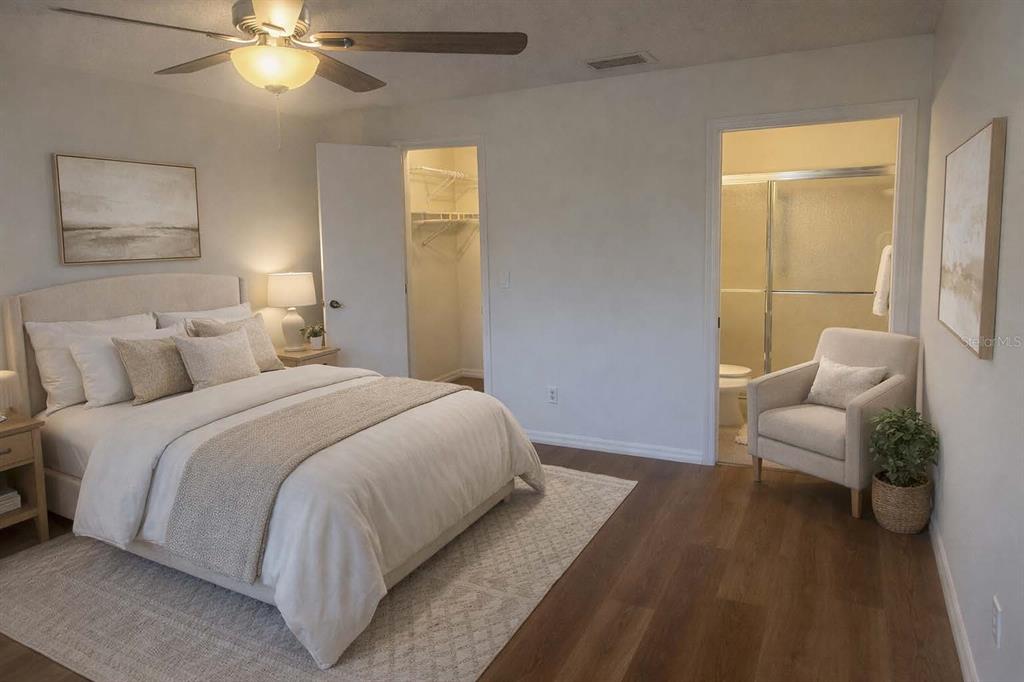 2033 Hawkhurst Circle, Unit 180 Sun City Center, FL 33573 - Photo 12 of 19 a bedroom with a bed and a couch
