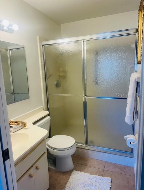 2033 Hawkhurst Circle, Unit 180 Sun City Center, FL 33573 - Photo 13 of 19 a white toilet sitting next to a bathroom sink