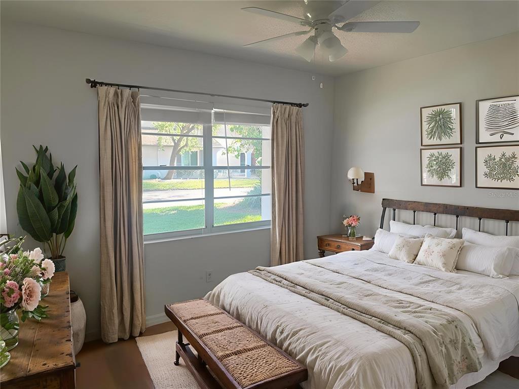 2033 Hawkhurst Circle, Unit 180 Sun City Center, FL 33573 - Photo 14 of 19 a bedroom with a bed and a window