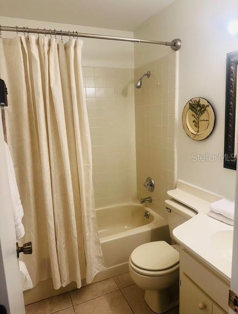 2033 Hawkhurst Circle, Unit 180 Sun City Center, FL 33573 - Photo 15 of 19 a bathroom with a granite countertop sink toilet and shower