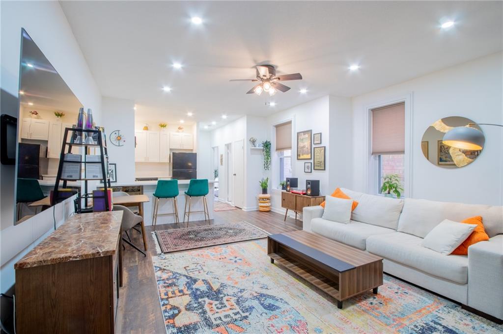 10104 4th Avenue, Unit 2B Brooklyn, NY 11209 - Photo 1 of 27 a living room with fireplace furniture and a flat screen tv