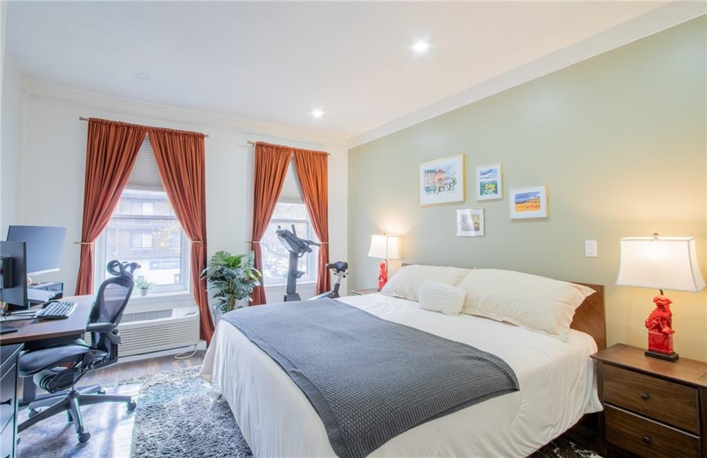 10104 4th Avenue, Unit 2B Brooklyn, NY 11209 - Photo 12 of 27 a bedroom with a large bed and a large window