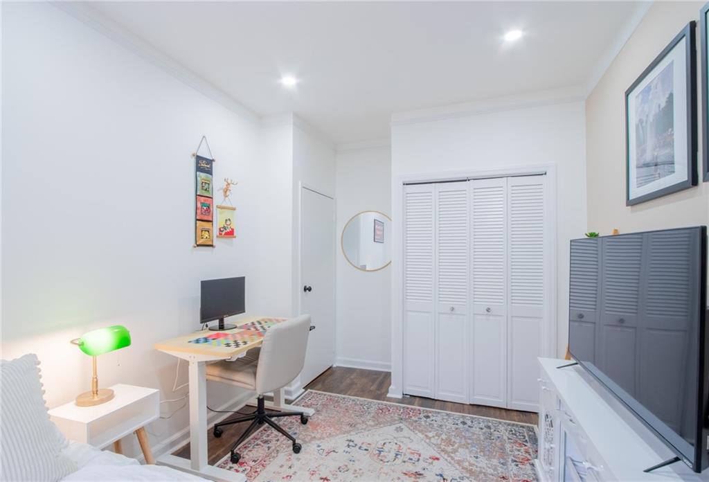 10104 4th Avenue, Unit 2B Brooklyn, NY 11209 - Photo 17 of 27 a workspace with furniture and wooden floor