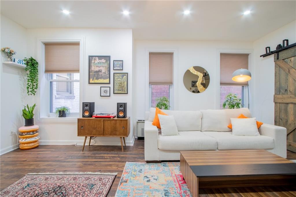 10104 4th Avenue, Unit 2B Brooklyn, NY 11209 - Photo 6 of 27 a living room with furniture and wooden floor