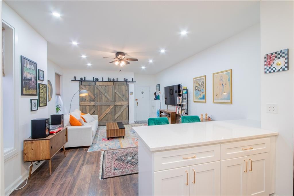 10104 4th Avenue, Unit 2B Brooklyn, NY 11209 - Photo 8 of 27 a living room with furniture and wooden floor