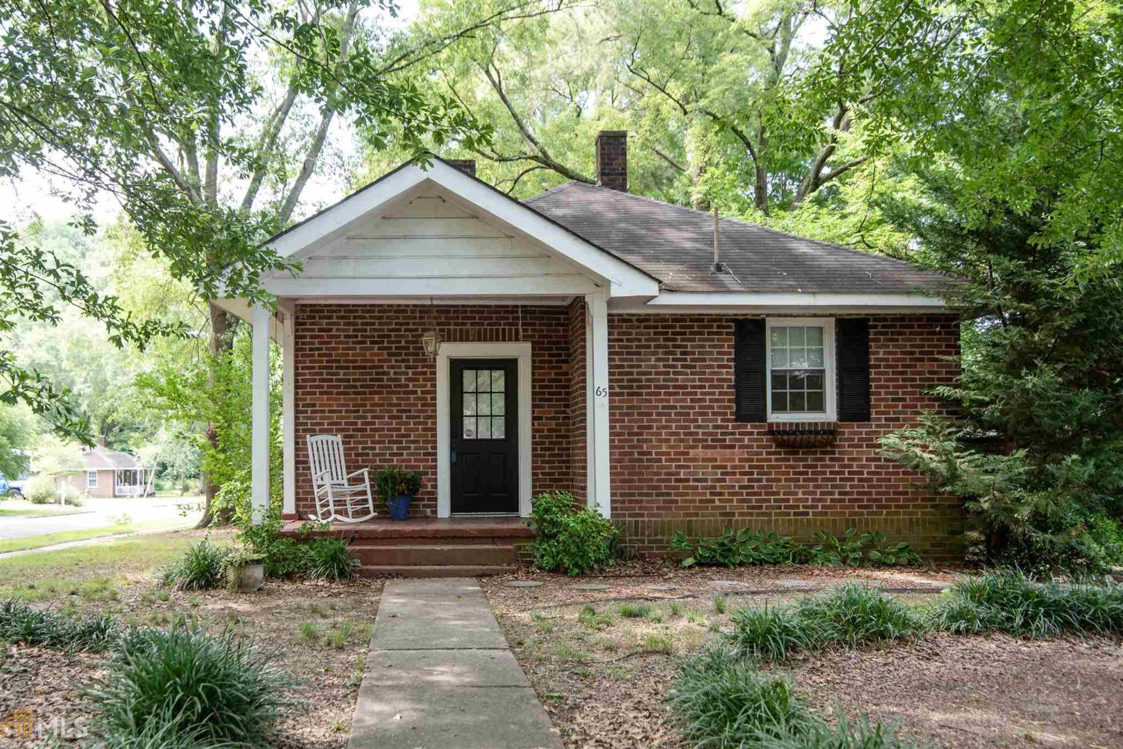65 Ash Street Northeast Rome, GA 30161 - Photo 1 of 1 a front view of a house with garden