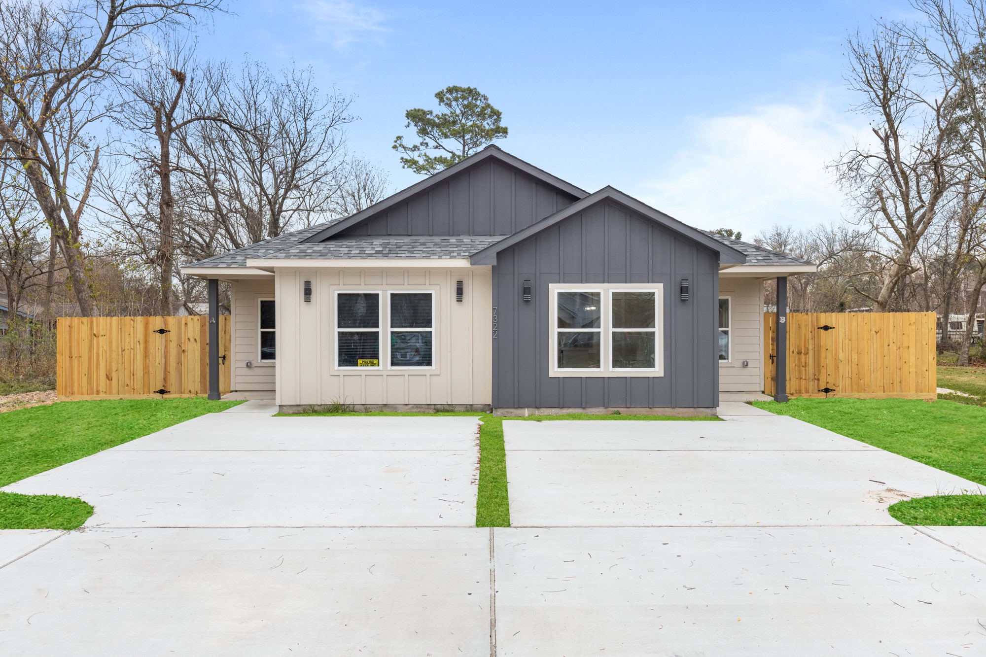 a house that has a large tree in front of it