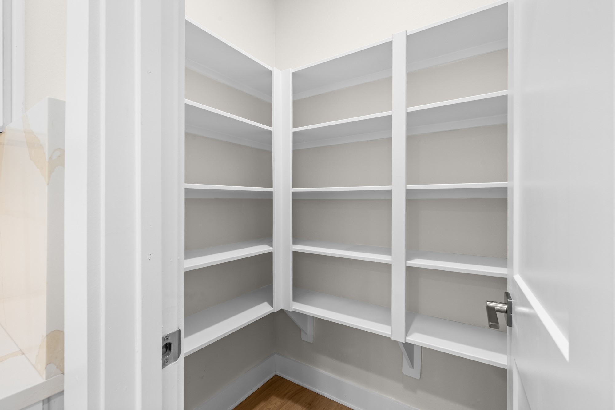 7322 Phillips Street Houston, TX 77088 - Photo 11 of 27 a view of walk in closet with empty racks