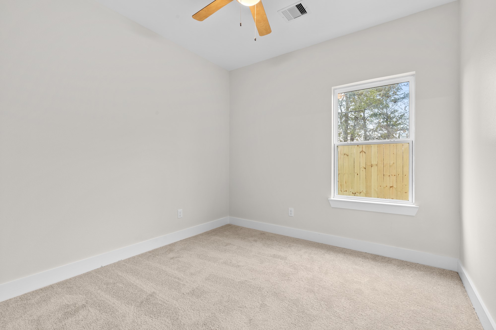 7322 Phillips Street Houston, TX 77088 - Photo 17 of 27 an empty room with a window