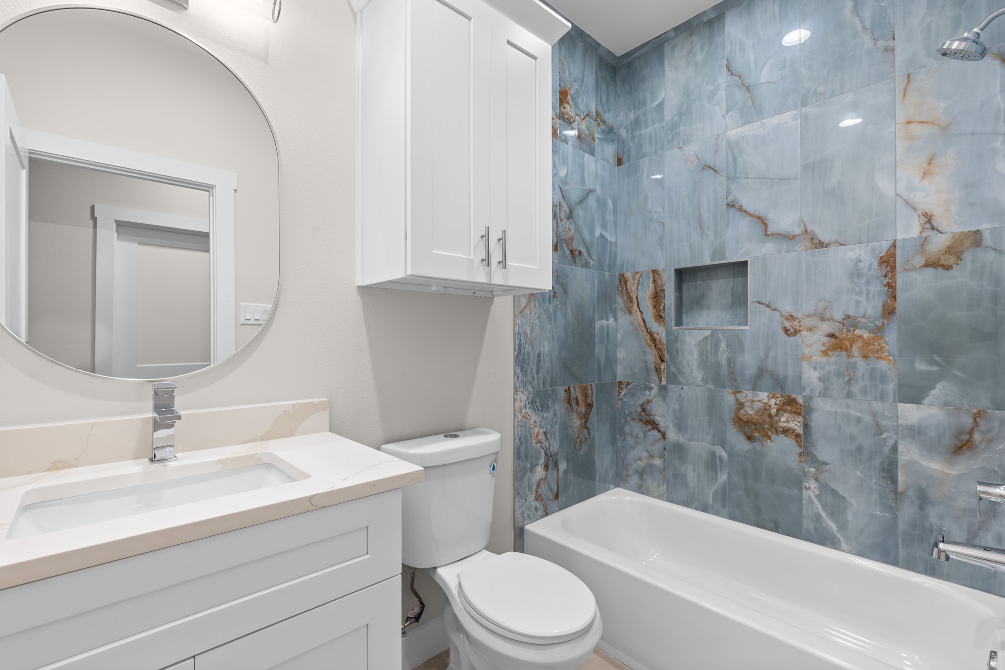 7322 Phillips Street Houston, TX 77088 - Photo 18 of 27 a bathroom with a sink toilet and shower