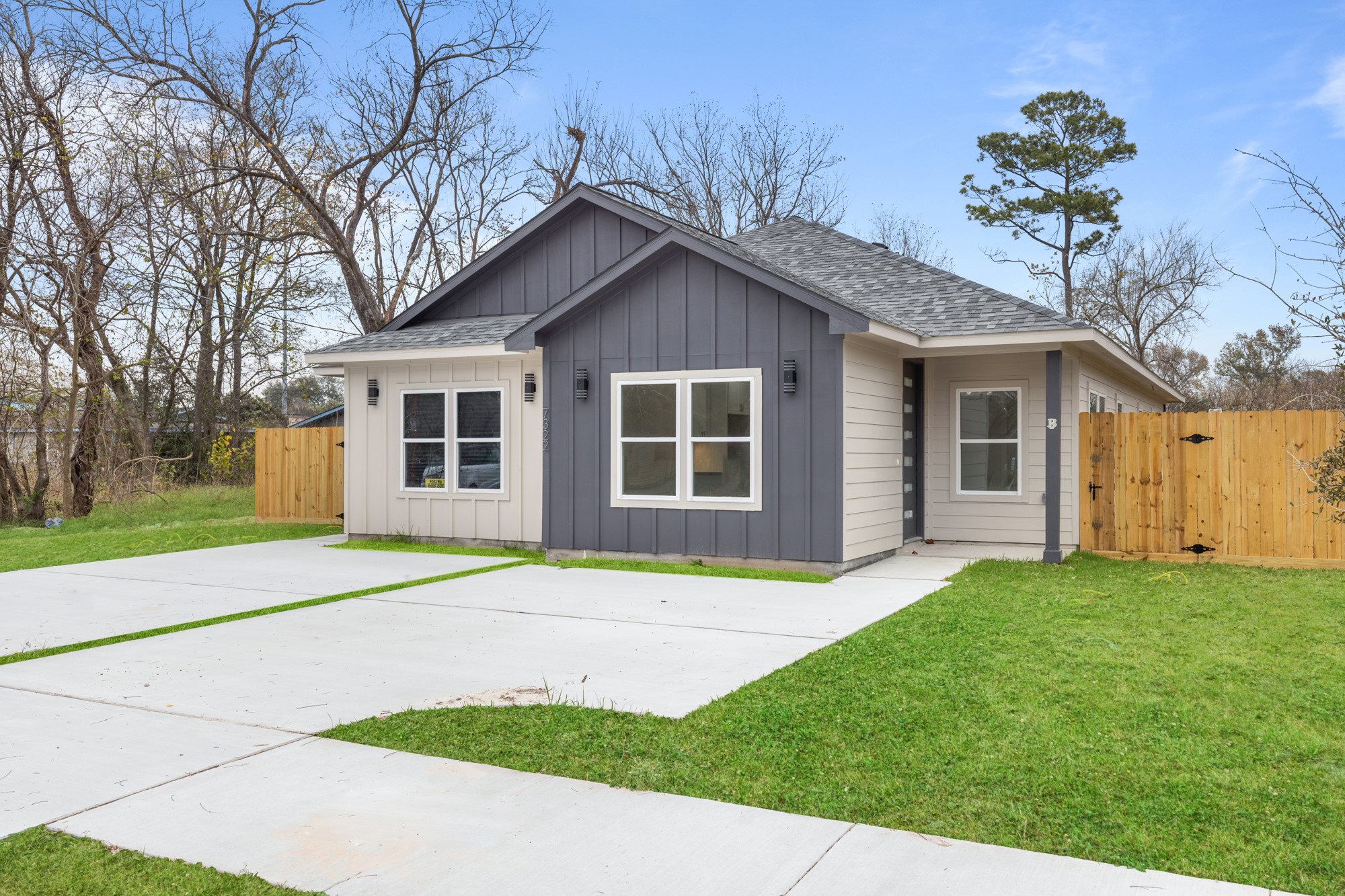 7322 Phillips Street Houston, TX 77088 - Photo 2 of 27 a house that has a big yard and large trees