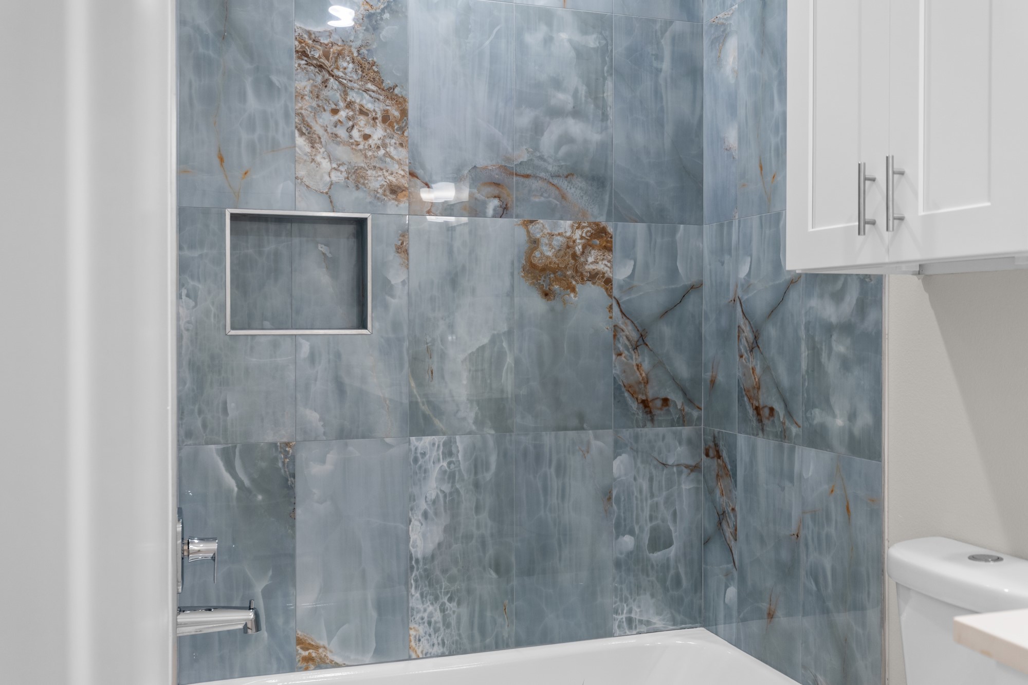 7322 Phillips Street Houston, TX 77088 - Photo 25 of 27 a bathroom with a toilet and a shower