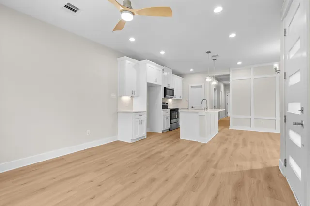 a view of kitchen with wooden floor