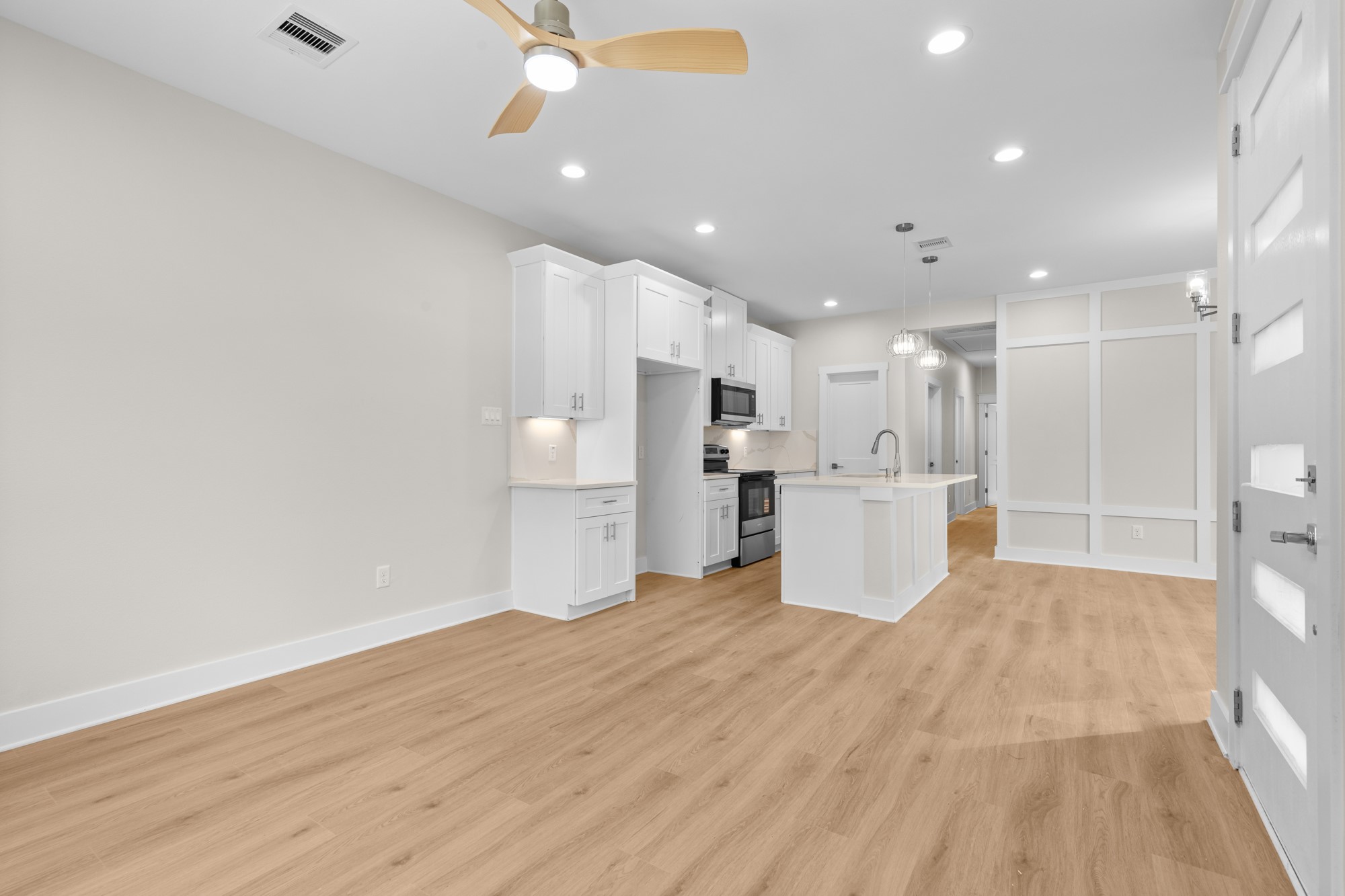 7322 Phillips Street Houston, TX 77088 - Photo 3 of 27 a view of kitchen with wooden floor