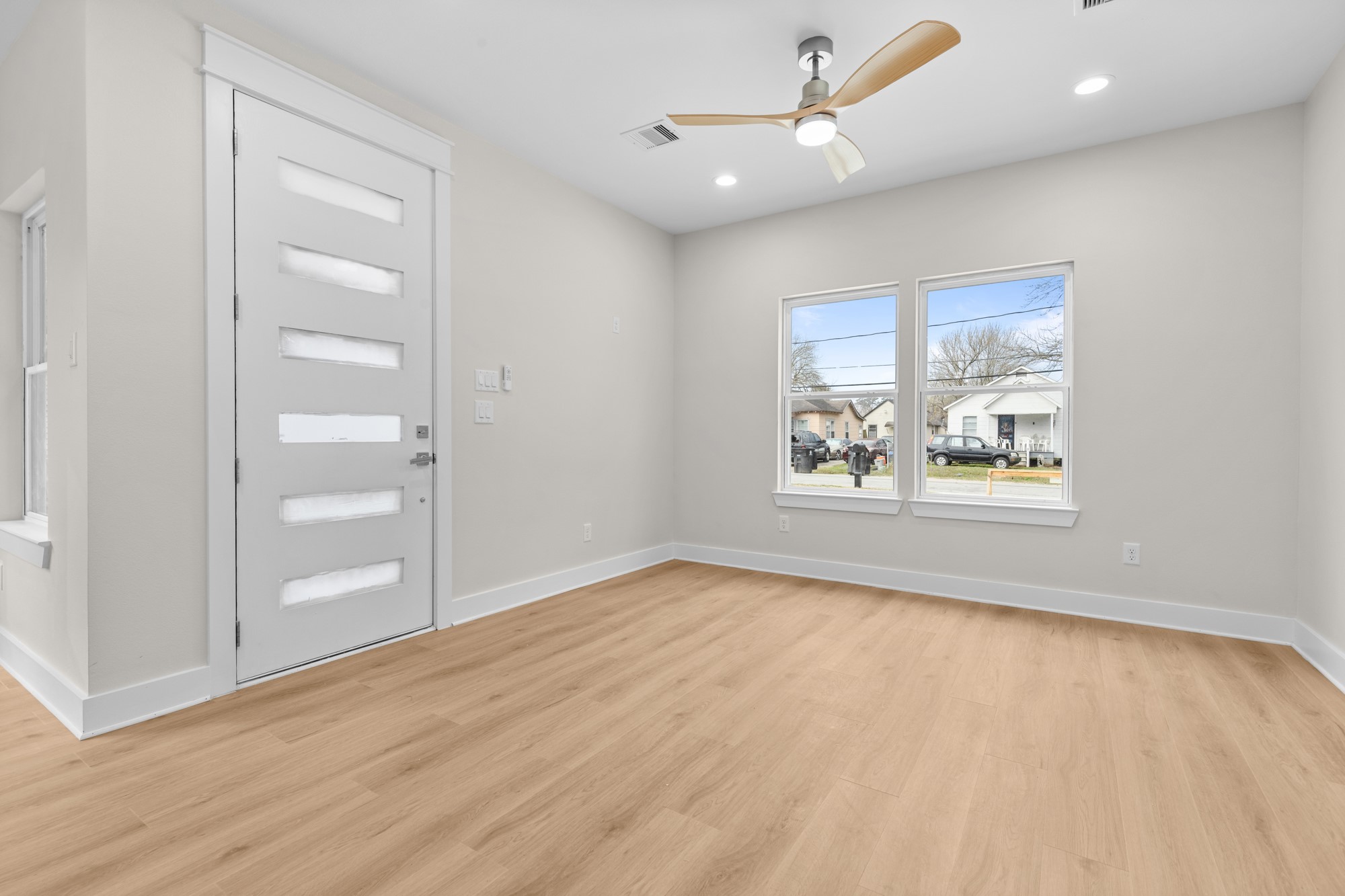 7322 Phillips Street Houston, TX 77088 - Photo 4 of 27 wooden floor in an empty room with a window