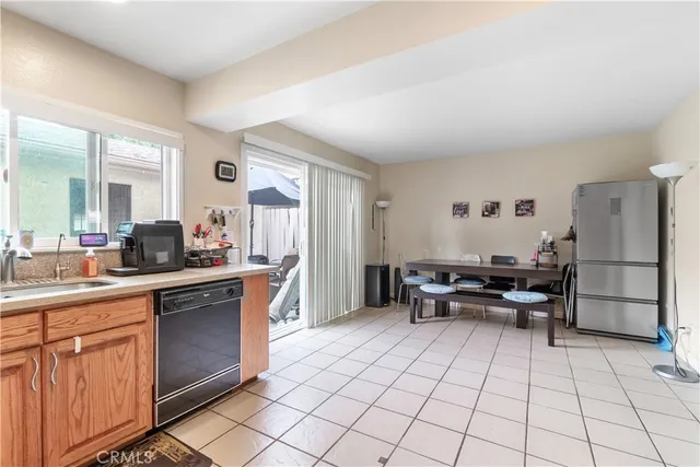 a kitchen with a sink a stove and a refrigerator