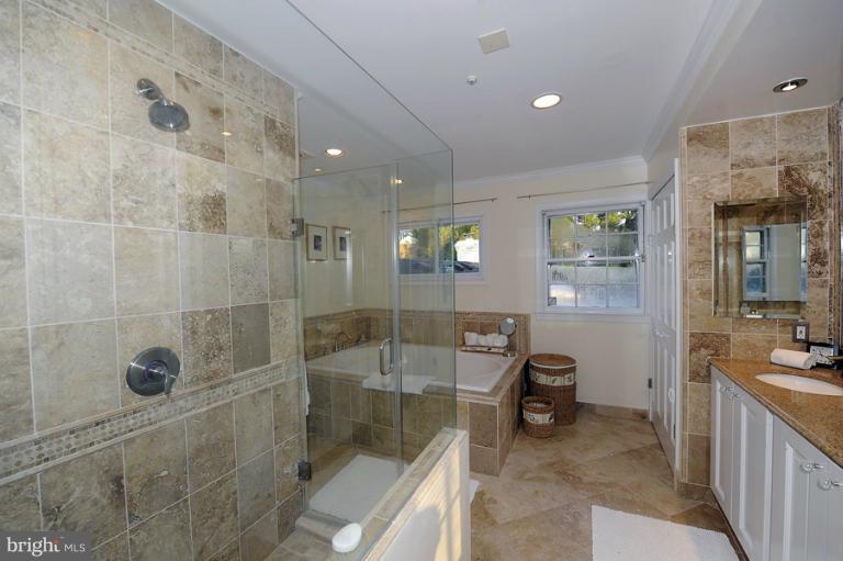 7720 Greentree Road Bethesda, MD 20817 - Photo 17 of 23 a bathroom with a sink a toilet and shower