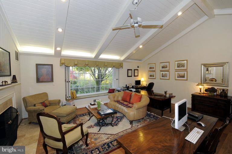 7720 Greentree Road Bethesda, MD 20817 - Photo 19 of 23 a living room with fireplace furniture and a large window