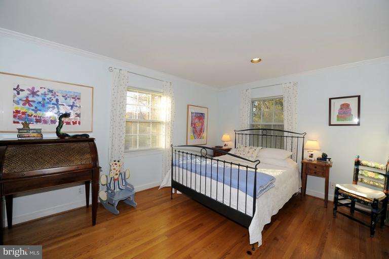 7720 Greentree Road Bethesda, MD 20817 - Photo 22 of 23 a bedroom with furniture and a window