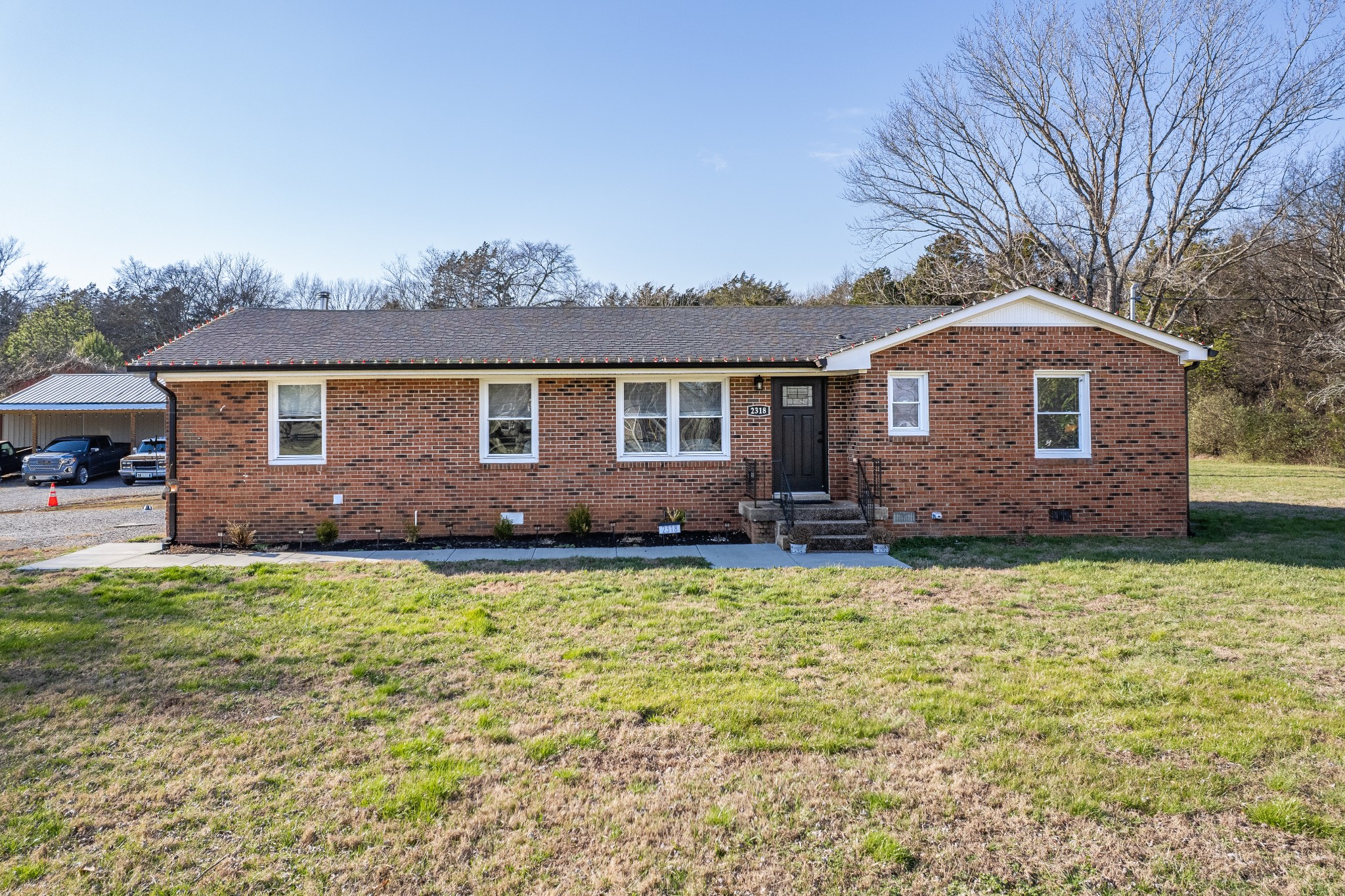 2318 Verona Caney Road Lewisburg, TN 37091 - Photo 2 of 70 a front view of a house with a garden