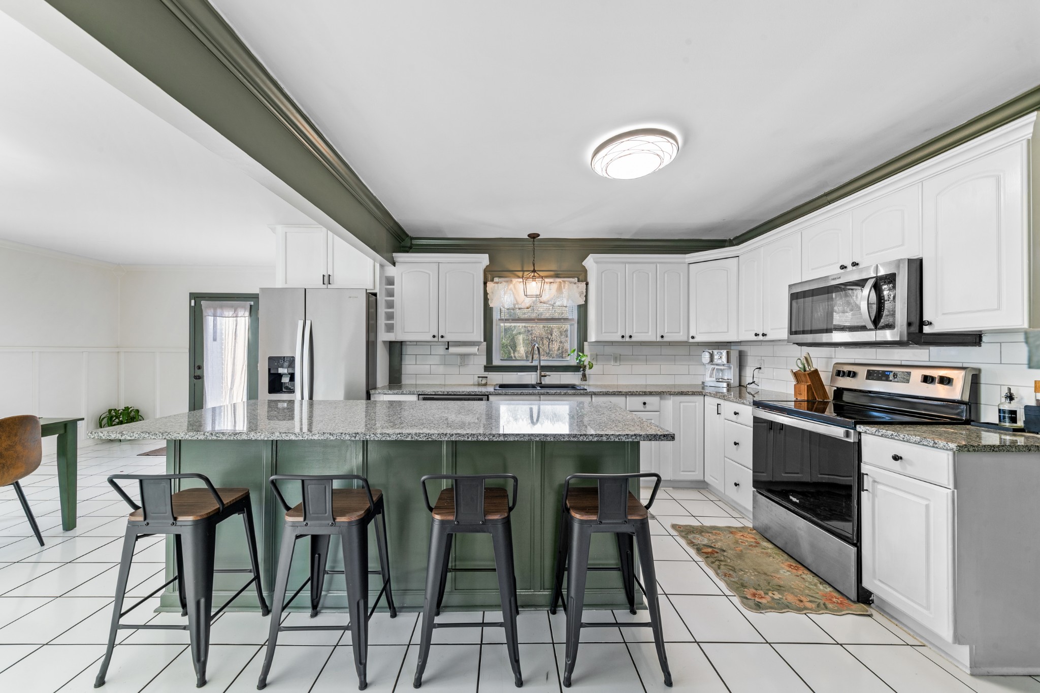 2318 Verona Caney Road Lewisburg, TN 37091 - Photo 23 of 70 a kitchen with cabinets a sink and chairs