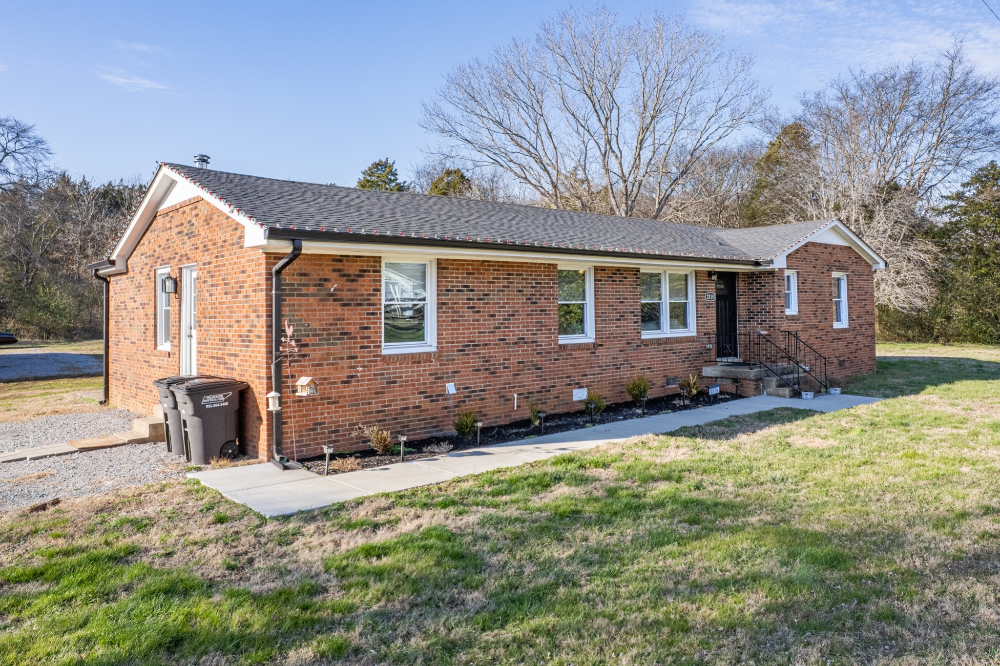 2318 Verona Caney Road Lewisburg, TN 37091 - Photo 4 of 70 a front view of a house with a garden and yard