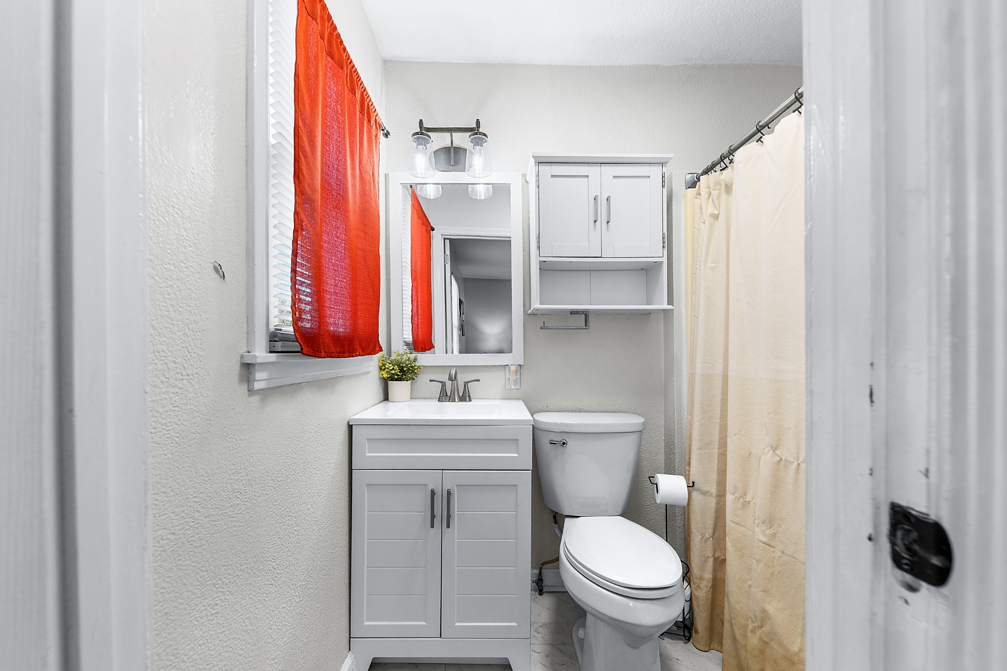 2318 Verona Caney Road Lewisburg, TN 37091 - Photo 42 of 70 a bathroom with a toilet a sink and a window