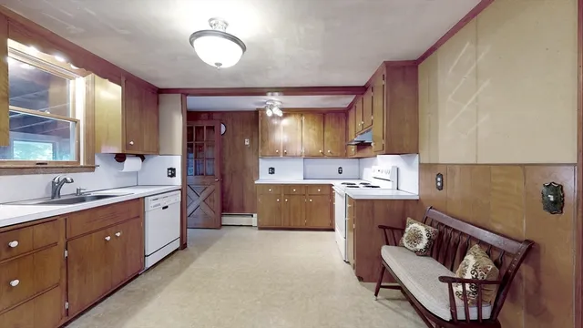 a spacious bathroom with a double vanity sink mirror and bathtub