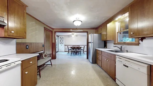 a kitchen with sink cabinets and window