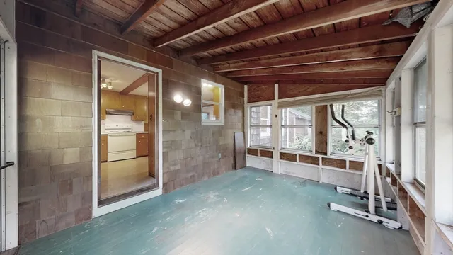 a view of an empty room with a fireplace